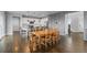 Spacious dining room featuring wood floors and an open-concept layout to the kitchen and stairway at 3234 Picketwire Way, Castle Rock, CO 80108