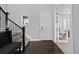 Welcoming foyer with hardwood floors, staircase, and adjacent office space at 3234 Picketwire Way, Castle Rock, CO 80108
