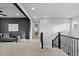 Upstairs landing with seating area, modern color palette, and views of the home's architecture and design at 3234 Picketwire Way, Castle Rock, CO 80108