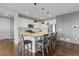Modern kitchen featuring granite countertop, stainless appliances, and island with seating at 3234 Picketwire Way, Castle Rock, CO 80108