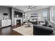 Cozy living room featuring a fireplace, modern furniture, and elegant decor at 3234 Picketwire Way, Castle Rock, CO 80108
