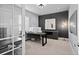 Bright home office with modern decor, a large desk, and ample natural light at 3234 Picketwire Way, Castle Rock, CO 80108