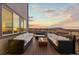 Inviting patio with comfortable seating and a fire pit, perfect for enjoying the sunset views at 3234 Picketwire Way, Castle Rock, CO 80108