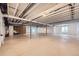 Unfinished basement with exposed ductwork, open ceilings, concrete floors, and ample space for future customization at 366 Agoseris Way, Castle Rock, CO 80104