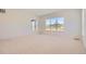 Spacious bedroom with neutral carpeting, large windows, and abundant natural light at 366 Agoseris Way, Castle Rock, CO 80104