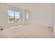 Bright bedroom featuring neutral carpeting, white walls, and an abundance of natural light from several windows at 366 Agoseris Way, Castle Rock, CO 80104