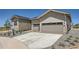 Exterior shot showcasing the driveway and the two-car garage at 366 Agoseris Way, Castle Rock, CO 80104