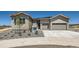 New construction home featuring a two-car garage and a stone-accented facade at 366 Agoseris Way, Castle Rock, CO 80104