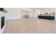 Open-concept living space with light hardwood floors and plenty of natural light at 366 Agoseris Way, Castle Rock, CO 80104