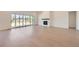 Bright living room with a modern fireplace, and sliding doors to the backyard at 366 Agoseris Way, Castle Rock, CO 80104