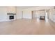 Spacious living room with a modern fireplace, light hardwood floors and recessed lighting at 366 Agoseris Way, Castle Rock, CO 80104