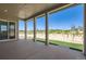 Covered patio with concrete flooring and pillars overlooking a scenic landscape of grass and shrubs at 366 Agoseris Way, Castle Rock, CO 80104