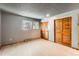 The bedroom features neutral flooring, a window, and a closet with bi-fold doors at 4070 S Atchison Way # 101, Aurora, CO 80014