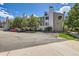 Inviting condo building featuring well-maintained landscaping and dedicated parking spaces for residents and visitors at 4070 S Atchison Way # 101, Aurora, CO 80014