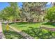 The home boasts green lawns, mature trees, and a well-manicured yard at 4070 S Atchison Way # 101, Aurora, CO 80014