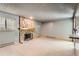 Bright living room with a stone fireplace and neutral flooring at 4070 S Atchison Way # 101, Aurora, CO 80014