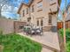 An inviting backyard featuring a fireplace, seating, and lush green grass at 383 S Franklin St, Denver, CO 80209