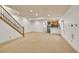 Spacious finished basement with stairs, carpet, and kitchenette at 383 S Franklin St, Denver, CO 80209