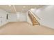 Large carpeted basement with stairs to the upper level at 383 S Franklin St, Denver, CO 80209