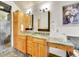 Bathroom with double vanity, granite counters and tile flooring at 383 S Franklin St, Denver, CO 80209
