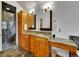 Bathroom with double vanity, granite countertops and custom tile shower at 383 S Franklin St, Denver, CO 80209