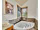 A close-up of a white bathtub with a tiled surround at 383 S Franklin St, Denver, CO 80209