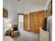Carpeted bedroom with walk-in closet, wooden trim, and soft lighting at 383 S Franklin St, Denver, CO 80209