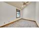 A bright bedroom featuring carpet, a window with wood trim, and a ceiling fan at 383 S Franklin St, Denver, CO 80209