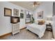 Cozy bedroom with carpeted floors, a ceiling fan, and a large window at 383 S Franklin St, Denver, CO 80209