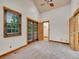 Light and airy bedroom with vaulted ceiling, double doors, and trim detail at 383 S Franklin St, Denver, CO 80209