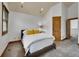 Cozy bedroom featuring a queen bed, carpet, natural light, and wooden trim at 383 S Franklin St, Denver, CO 80209