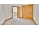 An inviting bedroom with a closet, carpet, and wood trim at 383 S Franklin St, Denver, CO 80209