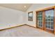 Bright bedroom with double doors leading outside and large window, providing ample natural light at 383 S Franklin St, Denver, CO 80209