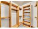 Walk-in closet with custom wood shelving and ample storage space for organized living at 383 S Franklin St, Denver, CO 80209