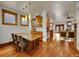 Spacious dining room with hardwood floors, wood trim, large windows and decorative lighting at 383 S Franklin St, Denver, CO 80209