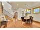 Elegant dining room with hardwood floors, natural light, adjacent to staircase and decorative lighting at 383 S Franklin St, Denver, CO 80209