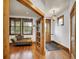 Inviting entryway featuring hardwood floors, decorative lighting, and an open doorway to the living room at 383 S Franklin St, Denver, CO 80209