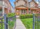 Charming home with covered front porch, stone accents and well-maintained landscaping at 383 S Franklin St, Denver, CO 80209