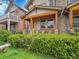 Beautiful home with covered porch, stone accents, seating and lush front yard at 383 S Franklin St, Denver, CO 80209