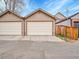Image of detached two car garages with white doors and siding at 383 S Franklin St, Denver, CO 80209