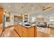 Open kitchen features a large island with sink and cooktop, plus views of the living area at 383 S Franklin St, Denver, CO 80209