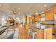 Spacious kitchen with a large island, breakfast bar, gas range, stone fireplace, and wood cabinets for a gourmet experience at 383 S Franklin St, Denver, CO 80209