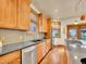 This kitchen showcases natural wood cabinets, granite counters, and stainless steel appliances at 383 S Franklin St, Denver, CO 80209