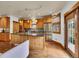 Spacious kitchen with wooden cabinetry, stainless steel appliances, and a center island, offering modern amenities at 383 S Franklin St, Denver, CO 80209