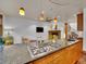Modern kitchen island cooktop granite countertops, and stainless steel appliances at 383 S Franklin St, Denver, CO 80209