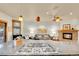 Modern kitchen island features a gas cooktop, granite countertop, and stylish pendant lighting at 383 S Franklin St, Denver, CO 80209