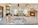 Well-lit kitchen with stainless steel cooktop island, wooden cabinetry, and comfortable seating area at 383 S Franklin St, Denver, CO 80209