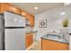 Basement kitchenette featuring granite countertops and stainless steel refrigerator at 383 S Franklin St, Denver, CO 80209