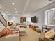 Basement living room with plush seating, a large television, and cozy decor, perfect for relaxation at 383 S Franklin St, Denver, CO 80209