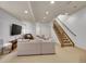Expansive living area with media center, lots of natural light, recessed lighting, and comfortable furniture at 383 S Franklin St, Denver, CO 80209